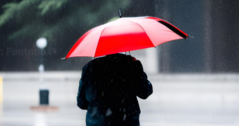 Persona bajo la lluvia. Imagen: Inteligencia artificial / LA FONTANA